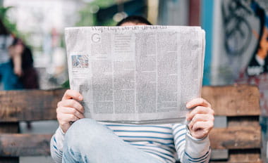 person reading newspaper